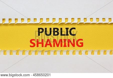 Public Shaming Symbol. Concept Words Public Shaming On Yellow Paper On A Beautiful White Background.