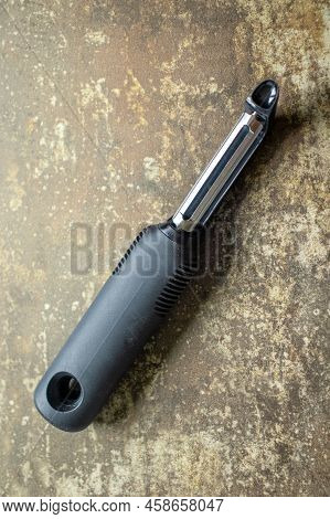 Top Down View Of An Isolated Swivel Metal Vegetable Peeler