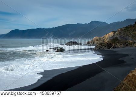 Waves Rolling In On Blacksand Beach At Shelter Cove, California.