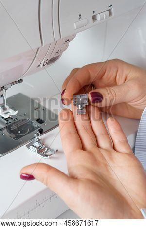 Seamstress Holds Sewing Machine Parts In Hands. Presser Foot Accessories In Tailor Hand. Dressmaker 
