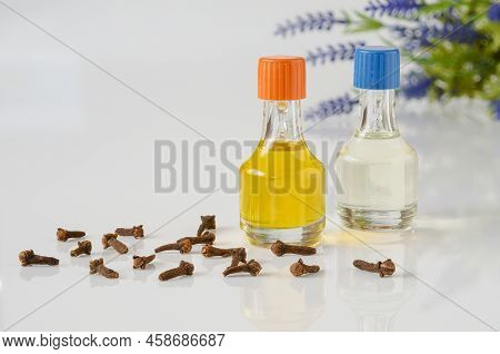 Clove And Lavender Oils. Essential Oils In Bottles