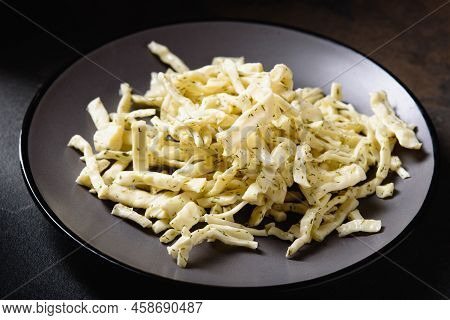 Chechil Soft Cheese On Dark Background. Homemade Chechil Cheese With Dill On Gray Platter. Snack For