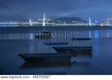 Skyline Of Shenzhen City, China At Night. Viewed From Hong Kong Border Lau Fau Shan