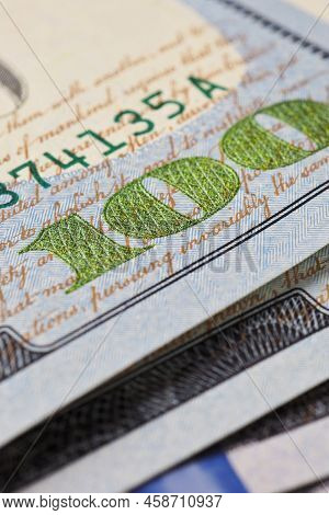 American Banknotes Of One Hundred Dollars. Fragment Of Bills Close-up. New Sample Money. Focus On Nu