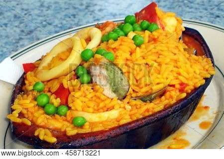 Paella Is A Saffron-flavored Dish Made Of Rice With Shellfish And Chicken