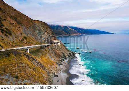 Pitkins Curve Bridge And Rain Rocks Rock Shed Along Pacific Coast Highway And Big Sur Coastline In C