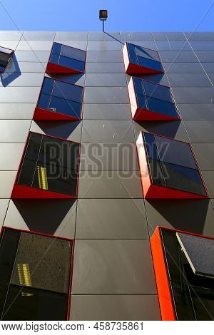 Rectilinear And Geometric Facade With Glass Windows Of The Town Hall Of Cartagena, Spain