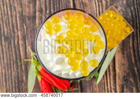 Banana, Strawberry And Pineapple Smoothie On Wooden Table And Bubble Tea Or Boba Tea Balls On It