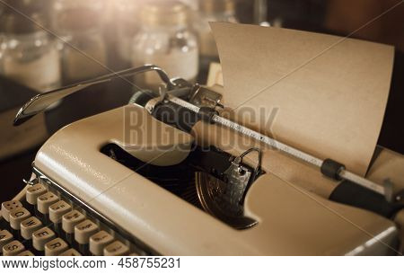 Focus On Old Sheet Of Paper On Old Typewriter Carriage, Retro Stlye Of Typewriter Mechanism, Sepie A