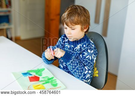 Little Kid Boy Making Paper Origami Tulip Flowers For A Postcard For Mothers Day Or Birthday. Cute C