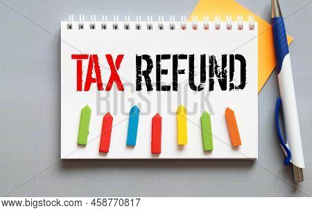 Notebook With A Business Notes Tax Refund On The Office Table With Tools. Concept Tax Refund With El