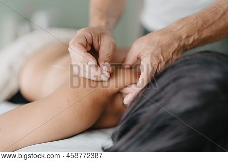 Acupuncturist Pinches Patients Neck To Insert Acupuncture Needle