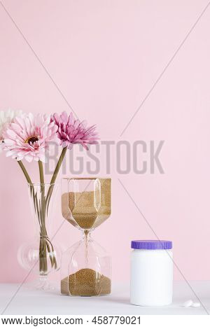 Women Health, Middle Age And Menopause Concept. Health Care Style. Copy Space. White Plastic Bottle 