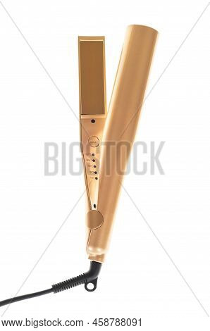 A Golden Hair Straightener Isolated On White Background