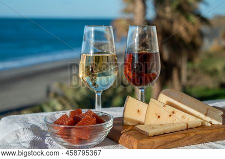 Spanish Hard Andalusian Cheese Filled With Sweet Sherry Served Outdoor With Membrillo Jam With Two G