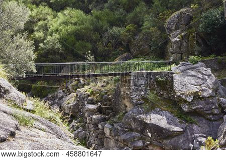 Waterfall And Rocks Of The Fafiao River, In The Gerês Natural Park (portugal)