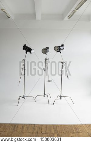 Professional Lighting Equipment, Flashes, C-stands On A Cyclorama In Modern Photo Studio. Octabox, S