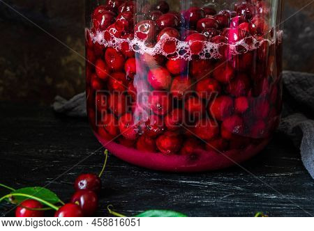 Homemade Liqueur From Cherries In A Jar Of A Natural Fermentation Process. Ukrainian Tincture.