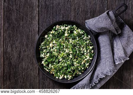 Spanakorizo, Greek Spinach And Rice Pilaf With Lemon, Dill, Scallion On A Pan On Dark Wooden Table, 
