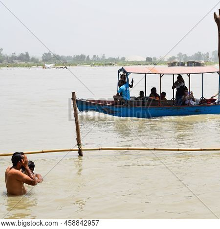Garh Mukteshwar, Uttar Pradesh, India - June 11 2022 - People Are Taking Holy Dip On The Occasion Of