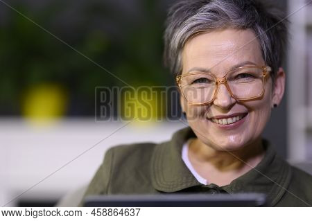 Business Mature Woman Looking At Camera. Attractive Joyful Middle Aged Woman Portait. Grey-haired Ha