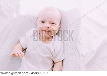 The Baby Is Lying In A Cocoon Of Copy Space . The Baby Is 0-3 Months Old. A Contented Infant. An Art