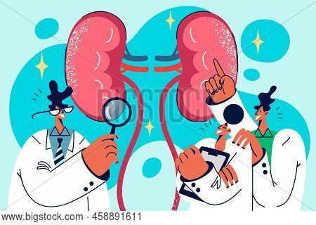 Team Of Doctors Look At Examine Patient Body Organ. Medical Specialists Discuss Client Treatment In 