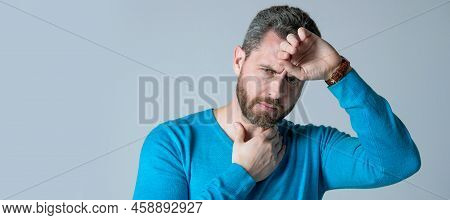 Mature Man With Beard Has Heacache Suffer From Headahce On Grey Background, Malaise. Man Face Portra