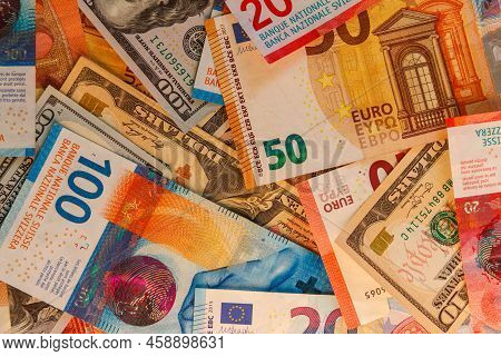Multicurrency Background Of Us Dollars, Euros And Swiss Francs