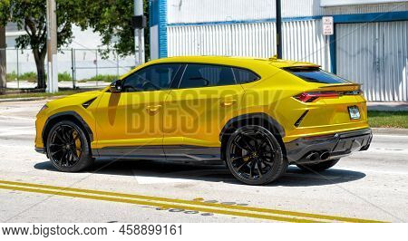 Miami Beach, Florida Usa - April 15, 2021: 2019 Yellow Giallo Auge Lamborghini Urus, Side View