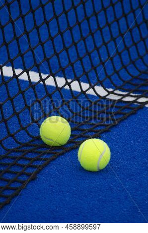 A Ball On A Paddle Court, Behind The Net.