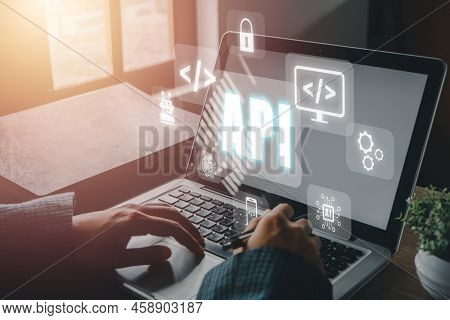 Api - Application Programming Interface, Woman Using Laptop Computer With Vr Screen Api Icon On Offi