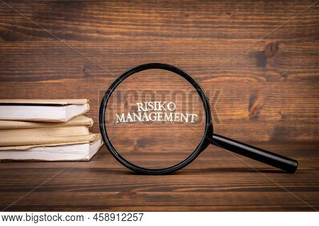 German Word Risiko Management, Risk Management. Magnifying Glass With Text