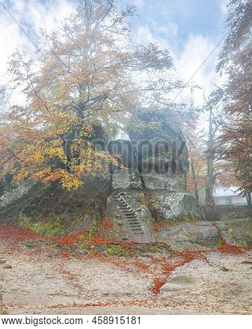 Forest And Ancient Rocks Of Dovbush In Bubnishche In The Carpathian Mountains. Foggy Wheather.  Loca