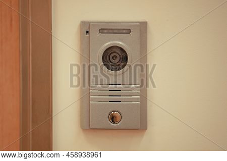 Video Intercom System On White Wall To Enter Office. Intercum With A Camera In The Office. New Video