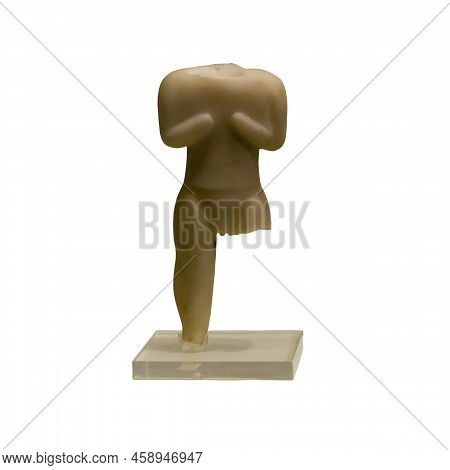 Ancient Figurine Of The Neolithic Period. An Isolated Object On A White Background.