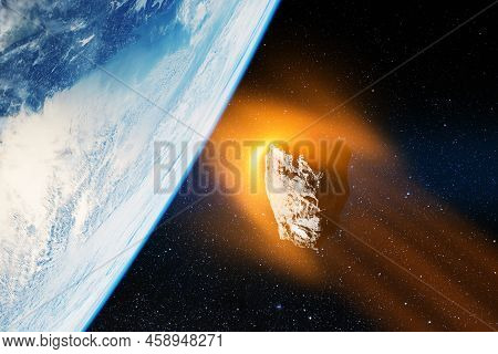 Planet Earth And Big Asteroid In The Space. Potentially Hazardous Asteroids. Asteroid In Outer Space