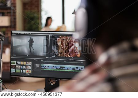 Young Freelancer Editing Footage On Software, Working To Edit Video Montage With Color Grading And A