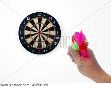 Human Hand Is Throwing The Darts Target To The Darts Board. A Man\'s Hand Throws A Dart At The Targe