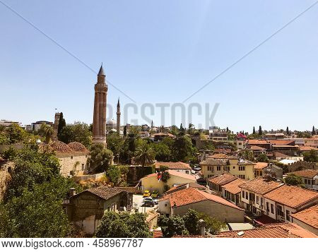 View Of The City From Above. Houses With Brown, Brick Roof. Life In A Tropical, Warm Country. Travel