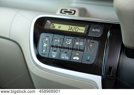 Novosibirsk, Russia -  July 29, 2022:   Honda N-box, Buttons For Turning On The Car Air Conditioner 