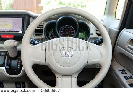 Novosibirsk, Russia -  July 29, 2022:   Honda N-box,  Car Interior - Steering Wheel, Shift Lever And