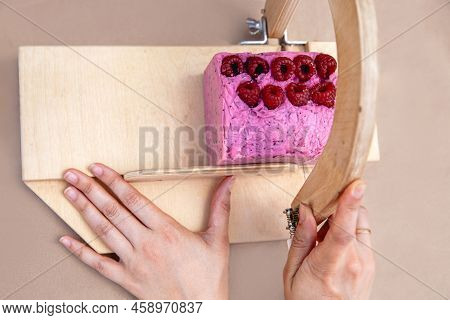 A Soap Maker Cuts Multi-colored Pieces Of Soap On A Special Wooden Device. View From Above. Only Han