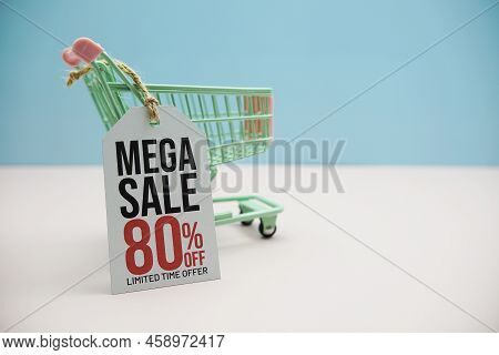 Mega Sale 80% Off Text Message On Price Tax With Shoppint Trolley Cart On Blue And Pink Background