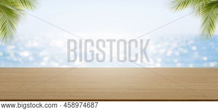 Wood Table On Blur Blue Sea And Palm Leave With Bue Sky Background.montage Mockup Tabletop On Water 
