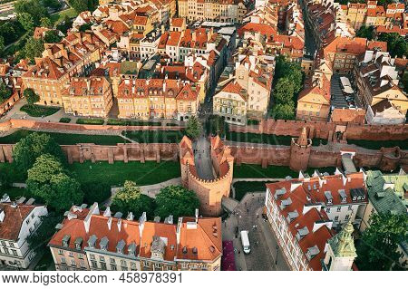 Old City In Warsaw With Red Roofs, Poland From Above. Travel Outdoor European Background With Wall A
