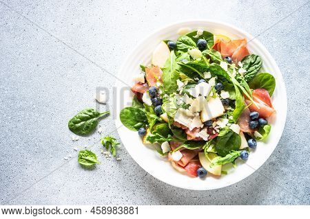 Salad With Jamon, Parmesan And Blueberry. Top View On White Background. Healthy Diet Fod.