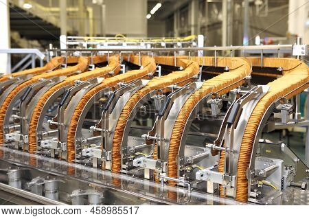 Large Biscuit Factory. A Line Of Biscuits In A Large Factory. Packing Crackers On The Machine. Innov