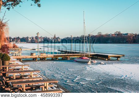Sailing Boat, Yacht Waiting For The Summer At Frozen Port, Hamburg, Aussenalster In Winter