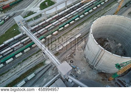 Aerial View Of Cargo Train Cars Loaded With Construction Goods At Mining Factory. Railway Transporta